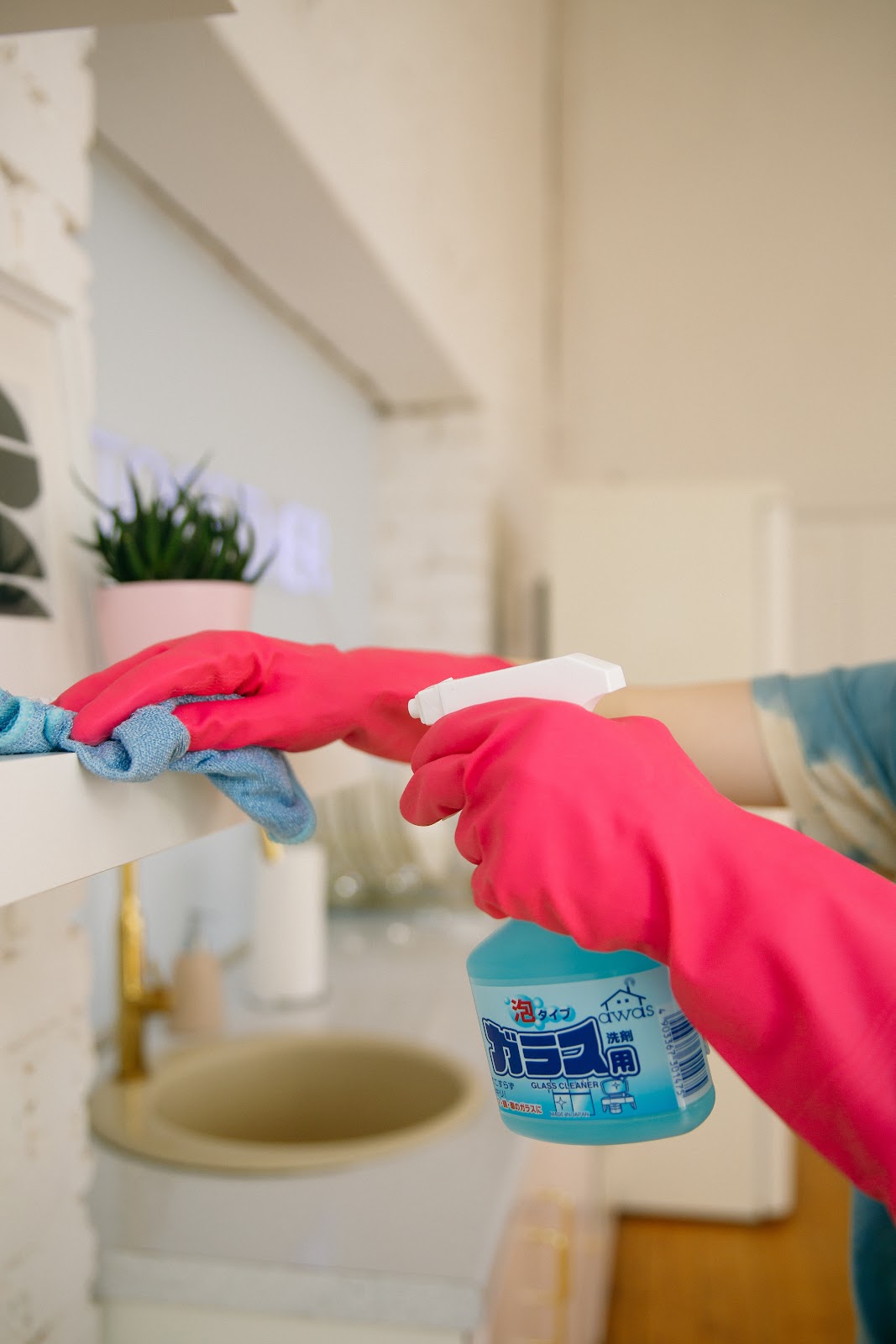 service worker in gloves washes furniture.