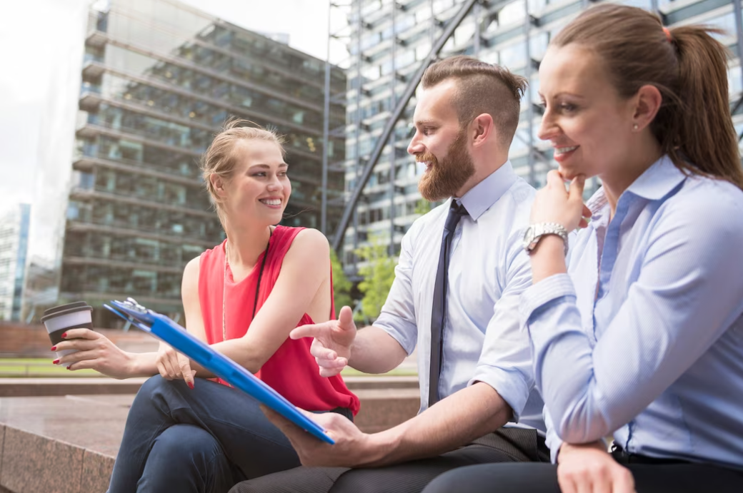 real estate agent talking with woman and smiling