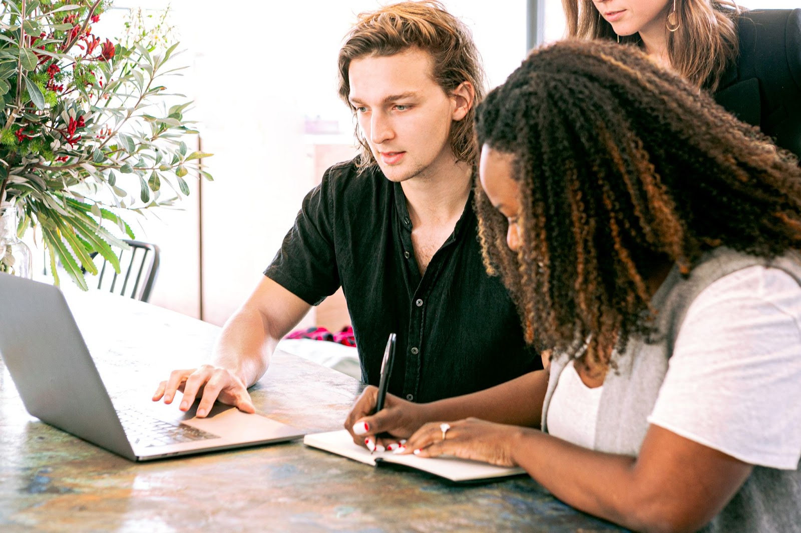 company employees discuss plans.