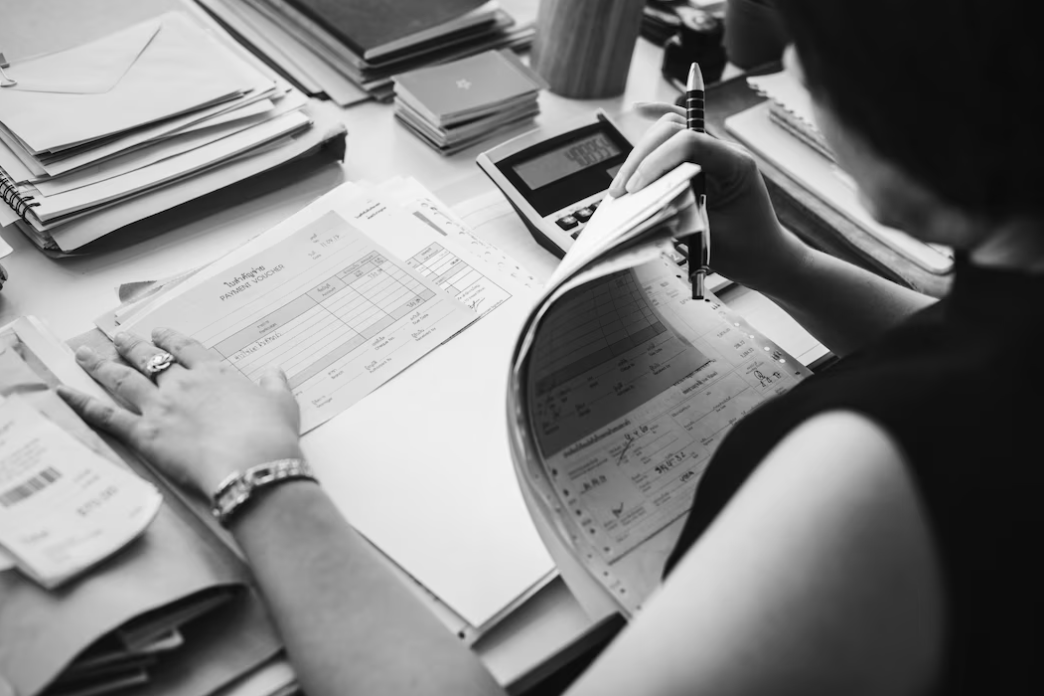 woman working in office  looks over the paperwork