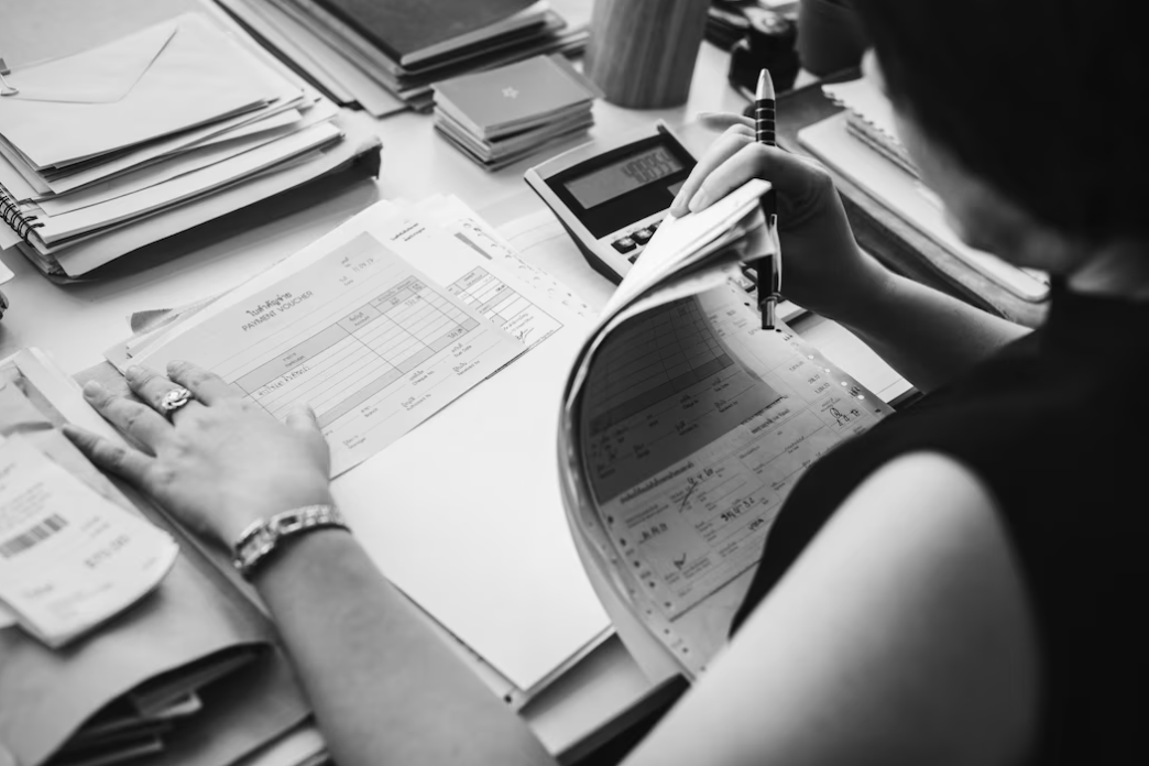 woman working in office looks over the paperwork
